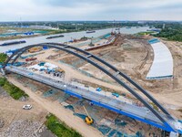 Workers work at the construction site of the Huaian Junction project of the second phase of the Huaihe River Waterway into the sea in Huai'a...