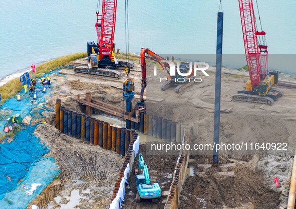 Workers work at the construction site of the Huaian Junction project of the second phase of the Huaihe River Waterway into the sea in Huai'a...