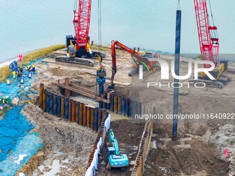 Workers work at the construction site of the Huaian Junction project of the second phase of the Huaihe River Waterway into the sea in Huai'a...