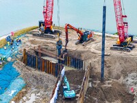 Workers work at the construction site of the Huaian Junction project of the second phase of the Huaihe River Waterway into the sea in Huai'a...