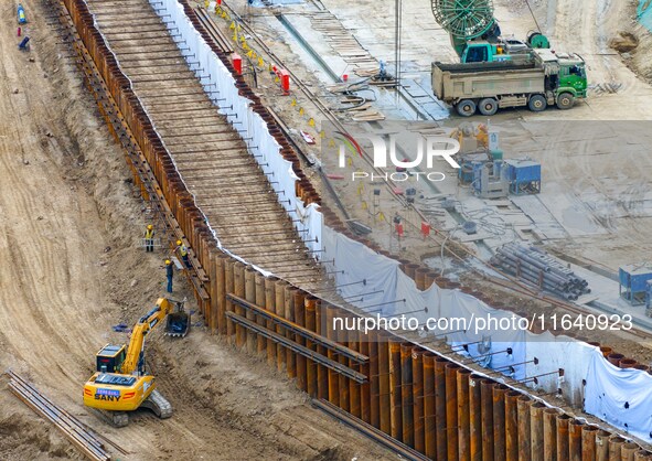 Workers work at the construction site of the Huaian Junction project of the second phase of the Huaihe River Waterway into the sea in Huai'a...