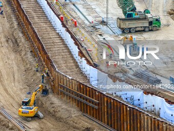 Workers work at the construction site of the Huaian Junction project of the second phase of the Huaihe River Waterway into the sea in Huai'a...