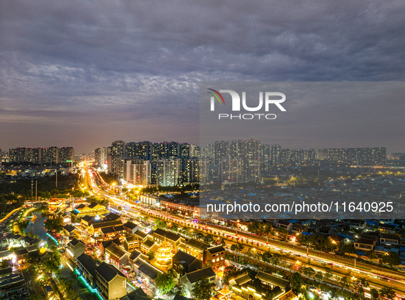 Tourists visit the Riverside Ancient Town in Huai'an, China, on October 5, 2024. 