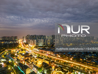 Tourists visit the Riverside Ancient Town in Huai'an, China, on October 5, 2024. (