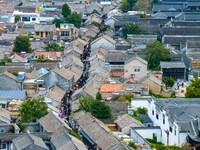 Tourists visit the Riverside Ancient Town in Huai'an, China, on October 5, 2024. (