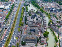 Tourists visit the Riverside Ancient Town in Huai'an, China, on October 5, 2024. (