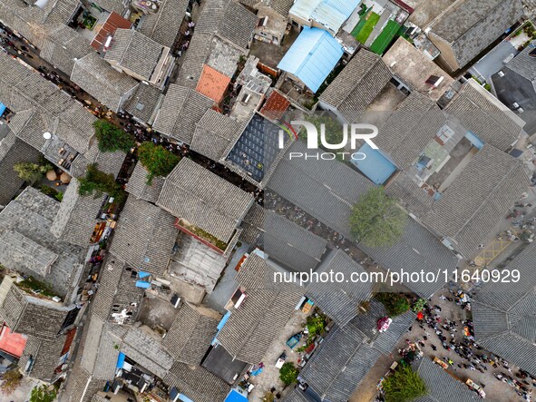 Tourists visit the Riverside Ancient Town in Huai'an, China, on October 5, 2024. 