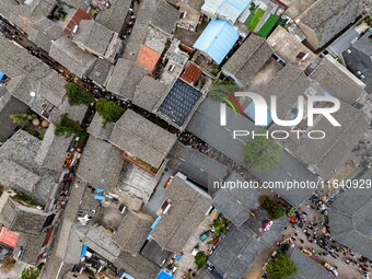 Tourists visit the Riverside Ancient Town in Huai'an, China, on October 5, 2024. (