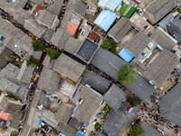 Tourists visit the Riverside Ancient Town in Huai'an, China, on October 5, 2024. (