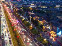 Tourists visit the Riverside Ancient Town in Huai'an, China, on October 5, 2024. (