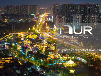 Tourists visit the Riverside Ancient Town in Huai'an, China, on October 5, 2024. (