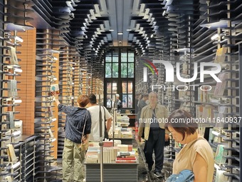 Visitors visit Zhongshuge Bookstore, the first bookstore to open in Tianjin, China, on September 30, 2024. (