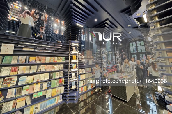 Visitors visit Zhongshuge Bookstore, the first bookstore to open in Tianjin, China, on September 30, 2024. 