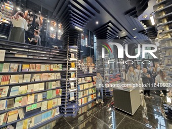 Visitors visit Zhongshuge Bookstore, the first bookstore to open in Tianjin, China, on September 30, 2024. (