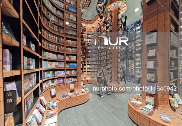 Visitors visit Zhongshuge Bookstore, the first bookstore to open in Tianjin, China, on September 30, 2024. 