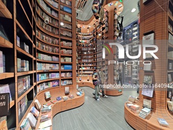 Visitors visit Zhongshuge Bookstore, the first bookstore to open in Tianjin, China, on September 30, 2024. (