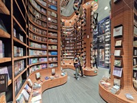 Visitors visit Zhongshuge Bookstore, the first bookstore to open in Tianjin, China, on September 30, 2024. (