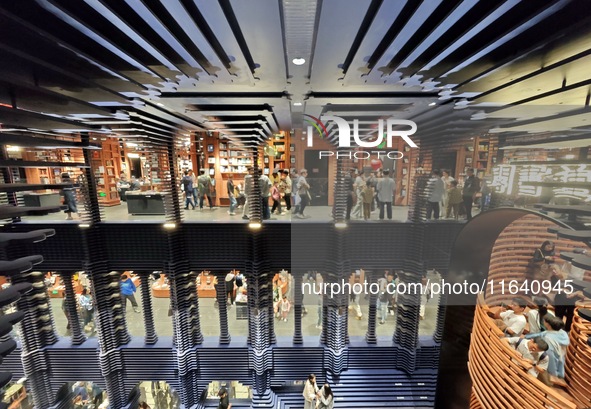 Visitors visit Zhongshuge Bookstore, the first bookstore to open in Tianjin, China, on September 30, 2024. 