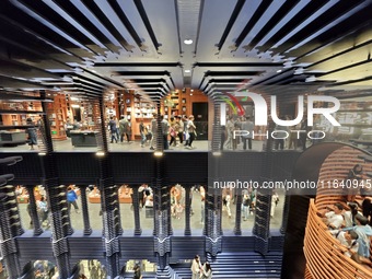 Visitors visit Zhongshuge Bookstore, the first bookstore to open in Tianjin, China, on September 30, 2024. (