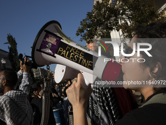 A person chants during a pro-Palestinian rally as part of an international day of action near the White House in Washington DC, USA, on Octo...