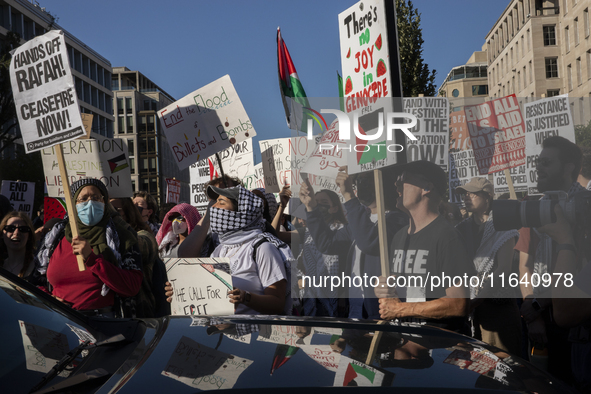 Hundreds gather during a pro-Palestinian rally as part of an international day of action near the White House in Washington DC, USA, on Octo...