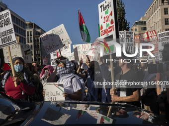 Hundreds gather during a pro-Palestinian rally as part of an international day of action near the White House in Washington DC, USA, on Octo...