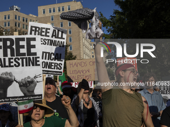 Hundreds gather during a pro-Palestinian rally as part of an international day of action near the White House in Washington DC, USA, on Octo...