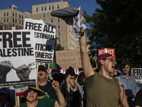 Hundreds gather during a pro-Palestinian rally as part of an international day of action near the White House in Washington DC, USA, on Octo...