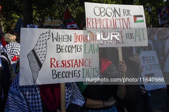 Hundreds gather during a pro-Palestinian rally as part of an international day of action near the White House in Washington DC, USA, on Octo...