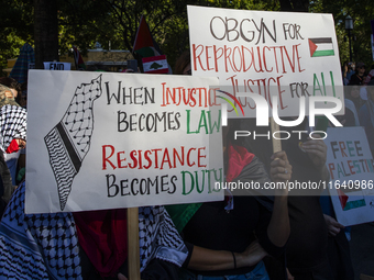 Hundreds gather during a pro-Palestinian rally as part of an international day of action near the White House in Washington DC, USA, on Octo...