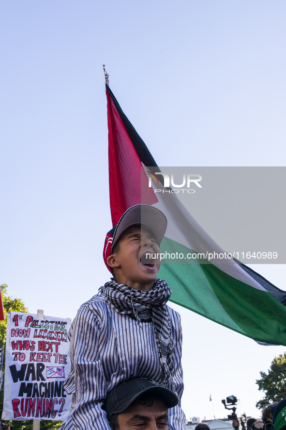 A boy chants during a pro-Palestinian rally as part of an international day of action near the White House in Washington DC, USA, on October...