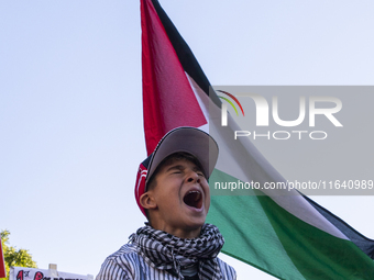 A boy chants during a pro-Palestinian rally as part of an international day of action near the White House in Washington DC, USA, on October...