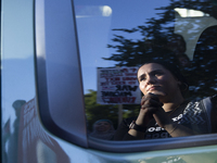 A demonstrator appears in a mirror reflection during a pro-Palestinian rally as part of an international day of action near the White House...