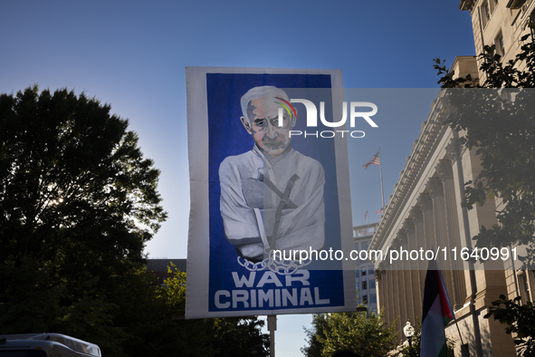 A large picture of Israeli Prime Minister Benjamin Netanyahu displays the text ''War Criminal'' during a pro-Palestinian rally as part of an...