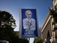 A large picture of Israeli Prime Minister Benjamin Netanyahu displays the text ''War Criminal'' during a pro-Palestinian rally as part of an...