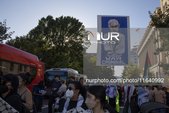 A large picture of Israeli Prime Minister Benjamin Netanyahu displays the text ''War Criminal'' during a pro-Palestinian rally as part of an...