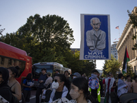 A large picture of Israeli Prime Minister Benjamin Netanyahu displays the text ''War Criminal'' during a pro-Palestinian rally as part of an...