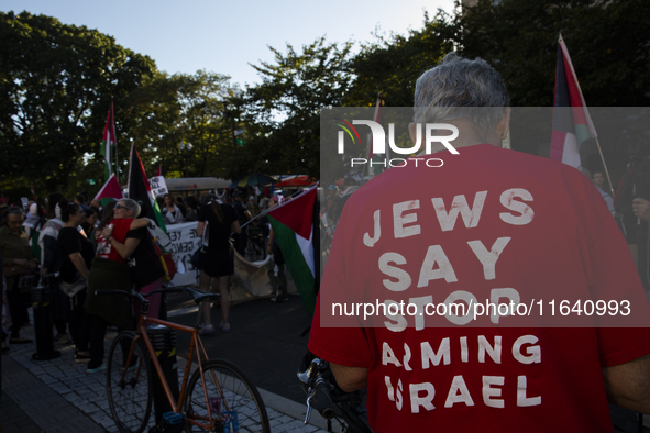 A person wears a red shirt with the text ''Jews Say Stop Arming Israel'' during a pro-Palestinian rally as part of an international day of a...