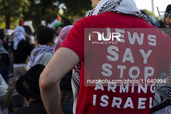 A person wears a red shirt with the text ''Jews Say Stop Arming Israel'' during a pro-Palestinian rally as part of an international day of a...