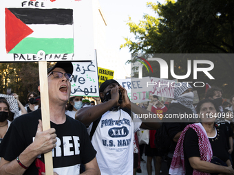 Demonstrators chant during a pro-Palestinian rally as part of an international day of action near the White House in Washington DC, USA, on...