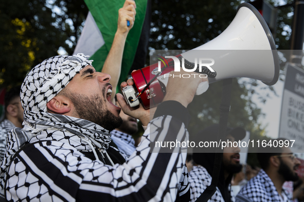 A demonstrator chants during a pro-Palestinian rally as part of an international day of action near the White House in Washington DC, USA, o...