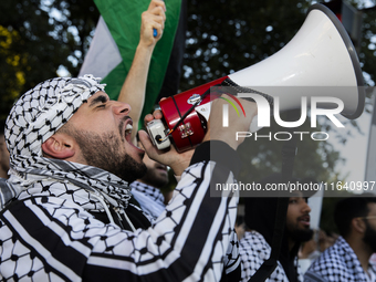 A demonstrator chants during a pro-Palestinian rally as part of an international day of action near the White House in Washington DC, USA, o...