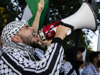 A demonstrator chants during a pro-Palestinian rally as part of an international day of action near the White House in Washington DC, USA, o...