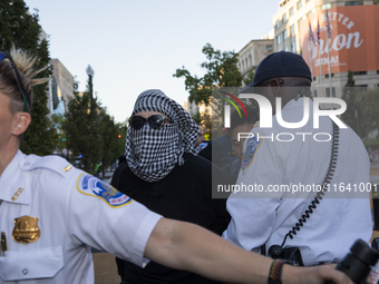 A demonstrator is arrested by police during a pro-Palestinian rally as part of an international day of action near the White House in Washin...