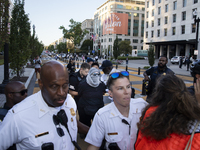 A demonstrator is arrested by police during a pro-Palestinian rally as part of an international day of action near the White House in Washin...