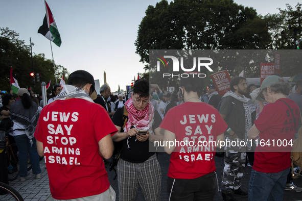 Demonstrators wear red shirts with the text ''Jews Say Stop Arming Israel'' during a pro-Palestinian rally as part of an international day o...