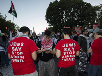 Demonstrators wear red shirts with the text ''Jews Say Stop Arming Israel'' during a pro-Palestinian rally as part of an international day o...