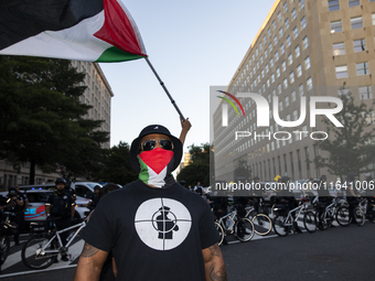 A person poses for photographs during a pro-Palestinian rally as part of an international day of action near the White House in Washington D...