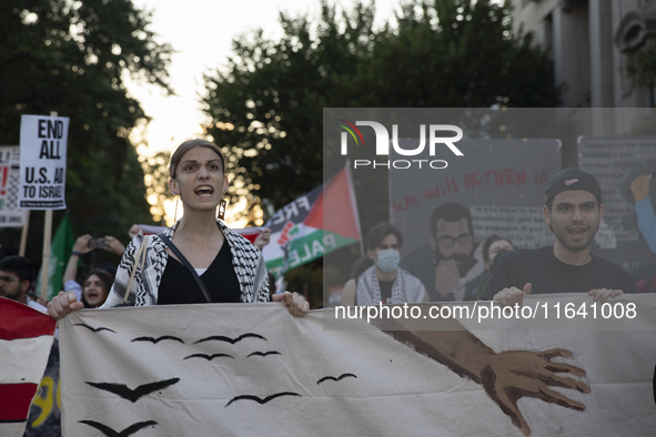 Hundreds gather during a pro-Palestinian rally as part of an international day of action near the White House in Washington DC, USA, on Octo...