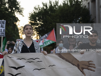 Hundreds gather during a pro-Palestinian rally as part of an international day of action near the White House in Washington DC, USA, on Octo...